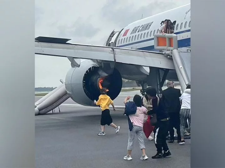 Passengers evacuated on runway at Singapore's Changi Airport after Air China plane engine catches fire