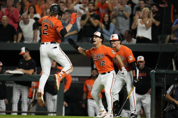 Henderson and Rodriguez help Orioles go a game up on Rays in AL East with 8-0 victory